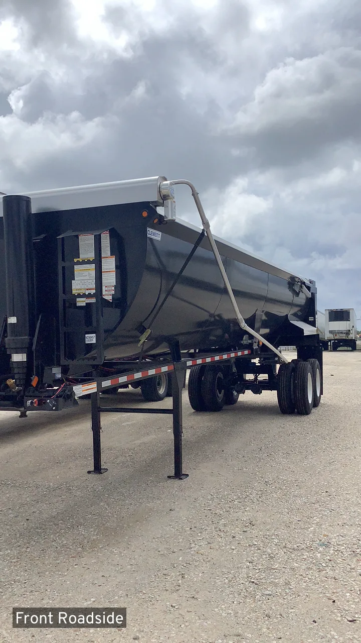 Black Clement Rockstar end dump trailer on the dealership lot