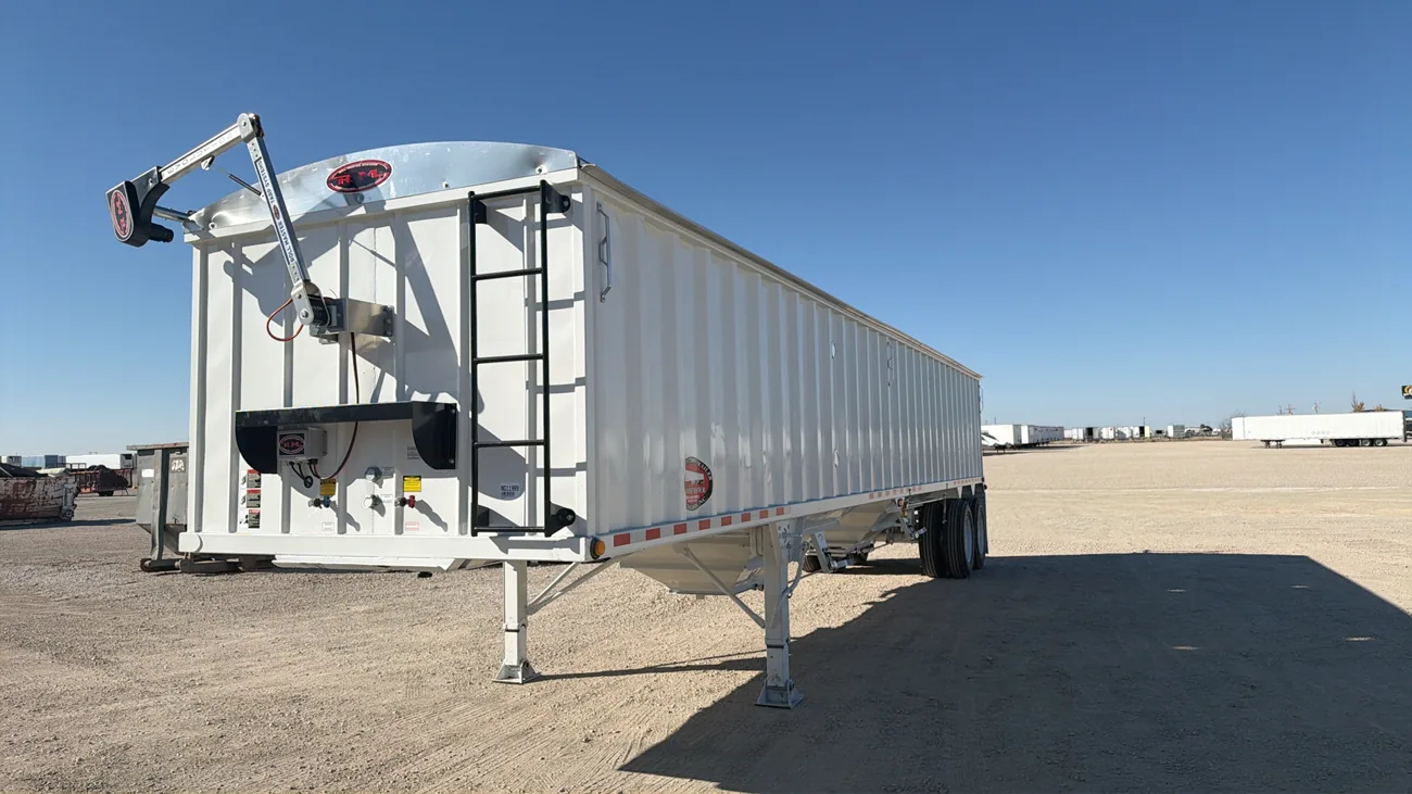 White CTS grain hopper trailer on the Amarillo dealership lot