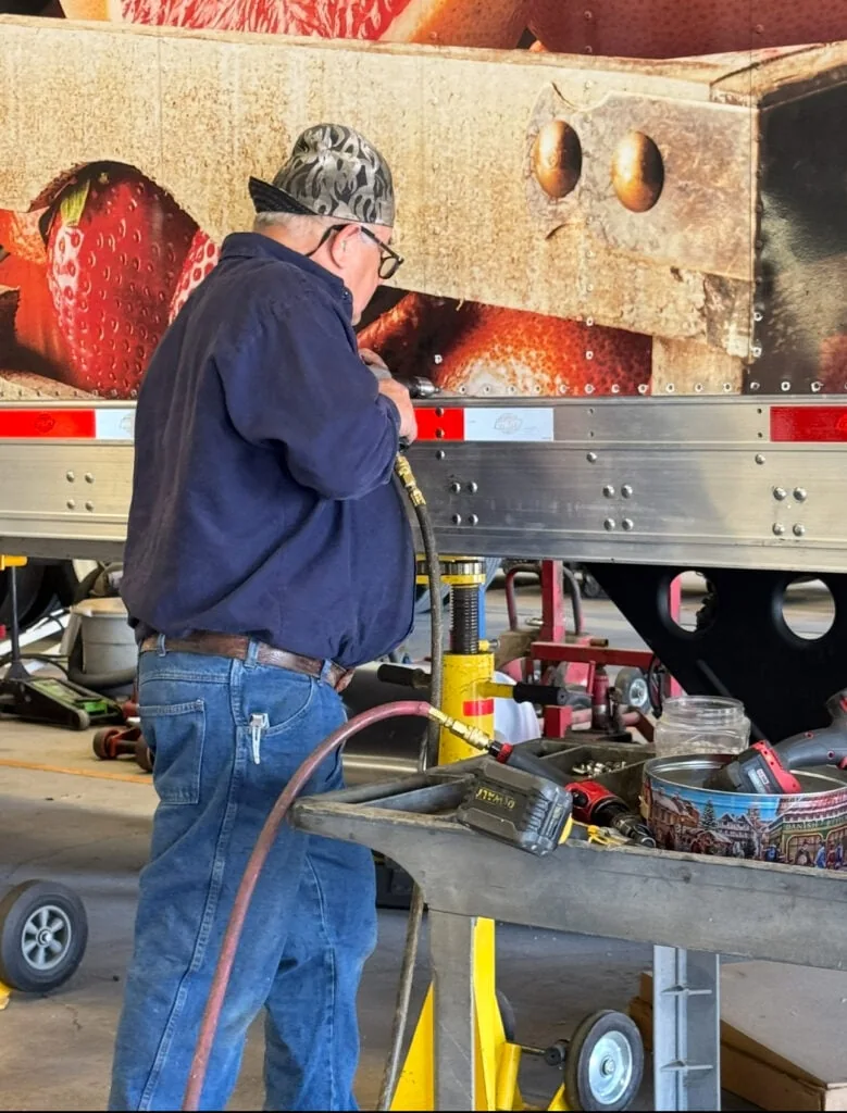 A Utility Trailer of Texas technician repairing a trailer