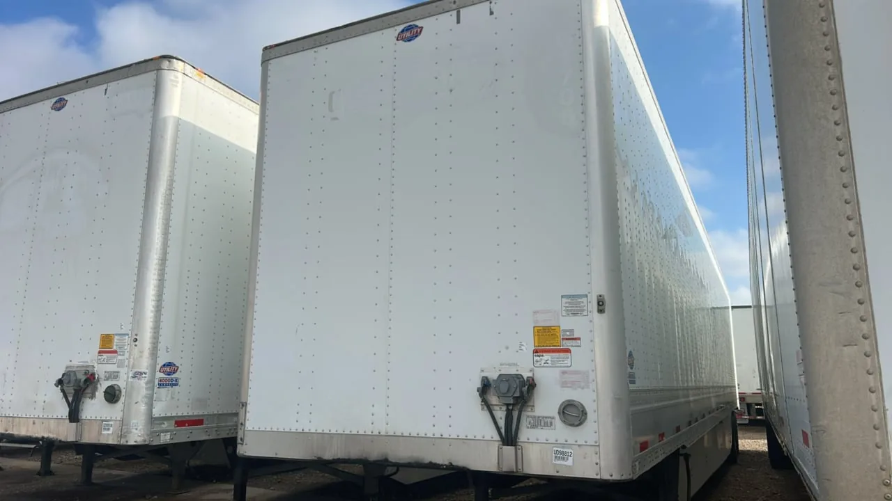 Utility dry van trailer with stock label UD98812 parked on the dealership lot