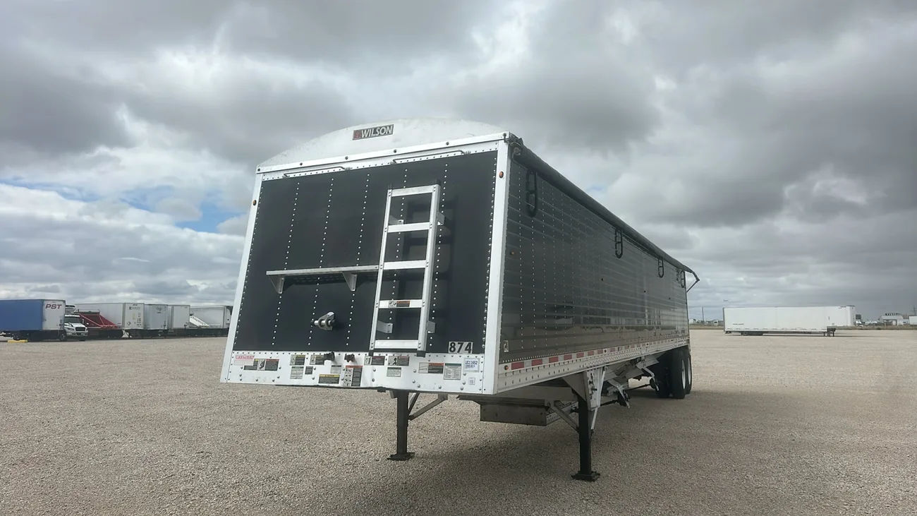 Black and silver Wilson grain hopper trailer on the Amarillo lot